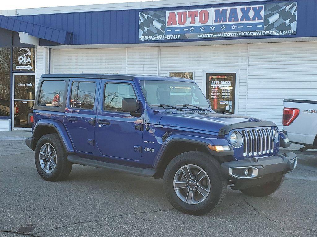 2020 Ocean Blue Metallic Clearcoat /Black Jeep Wrangler Unlimited Sahara (1C4HJXEG7LW) with an 3.6L V6 DOHC 24V FFV engine, 6A transmission, located at 234 Columbia Ave, Battle Creek, MI, 49015, (269) 222-0088, 42.298264, -85.192543 - <b>Equipment</b><br>Carry lots of cargo while your passengers are comfortable. When you encounter slick or muddy roads, you can engage the four wheel drive on this unit and drive with confidence. This unit has a V6, 3.6L high output engine. This 2020 Jeep Wrangler is equipped with a gasoline engine. - Photo#0