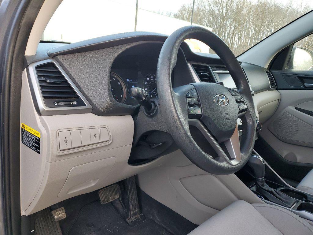 2017 GREY /GREY Hyundai Tucson SE w/Preferred Package AWD (KM8J3CA40HU) with an 2.0L L4 DOHC 16V engine, 6A transmission, located at 6064 Gull Rd, Kalamazoo, MI, 49048, (269) 222-0088, 42.328388, -85.512924 - Introducing the 2017 Hyundai Tucson SE AWD, a versatile and reliable compact SUV ideal for both urban and off-road adventures. This well-maintained vehicle comes with a CARFAX 1-Owner history and a clean report, ensuring peace of mind for its next owner. Under the hood, you'll find a robust 4-cylind - Photo#15