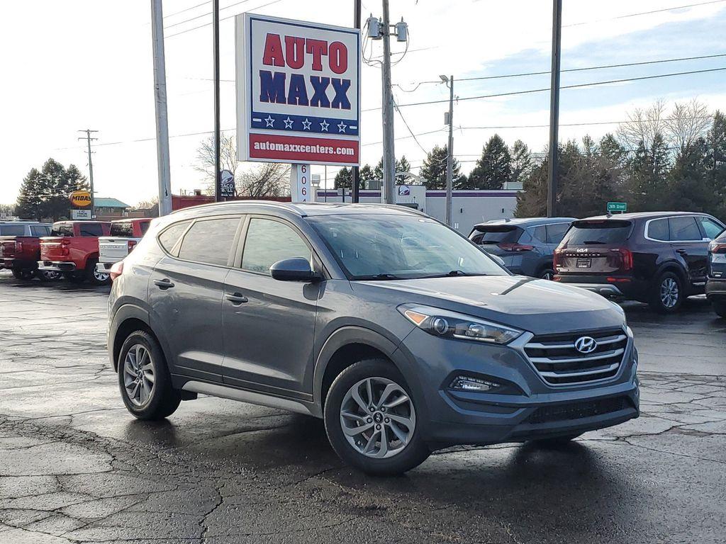 2017 GREY /GREY Hyundai Tucson SE w/Preferred Package AWD (KM8J3CA40HU) with an 2.0L L4 DOHC 16V engine, 6A transmission, located at 6064 Gull Rd, Kalamazoo, MI, 49048, (269) 222-0088, 42.328388, -85.512924 - Introducing the 2017 Hyundai Tucson SE AWD, a versatile and reliable compact SUV ideal for both urban and off-road adventures. This well-maintained vehicle comes with a CARFAX 1-Owner history and a clean report, ensuring peace of mind for its next owner. Under the hood, you'll find a robust 4-cylind - Photo#0