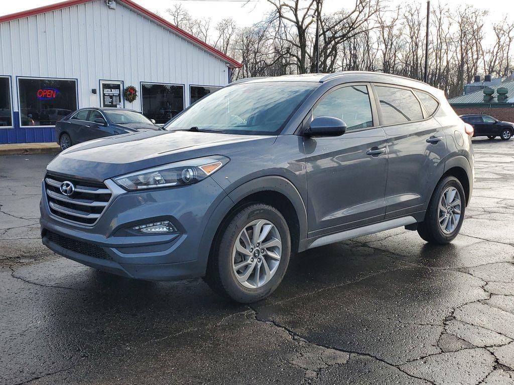 2017 GREY /GREY Hyundai Tucson SE w/Preferred Package AWD (KM8J3CA40HU) with an 2.0L L4 DOHC 16V engine, 6A transmission, located at 6064 Gull Rd, Kalamazoo, MI, 49048, (269) 222-0088, 42.328388, -85.512924 - Introducing the 2017 Hyundai Tucson SE AWD, a versatile and reliable compact SUV ideal for both urban and off-road adventures. This well-maintained vehicle comes with a CARFAX 1-Owner history and a clean report, ensuring peace of mind for its next owner. Under the hood, you'll find a robust 4-cylind - Photo#1