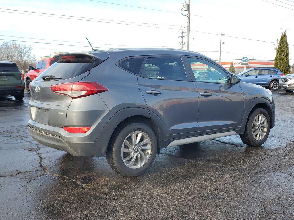 2017 GREY /GREY Hyundai Tucson SE w/Preferred Package AWD (KM8J3CA40HU) with an 2.0L L4 DOHC 16V engine, 6A transmission, located at 6064 Gull Rd, Kalamazoo, MI, 49048, (269) 222-0088, 42.328388, -85.512924 - Introducing the 2017 Hyundai Tucson SE AWD, a versatile and reliable compact SUV ideal for both urban and off-road adventures. This well-maintained vehicle comes with a CARFAX 1-Owner history and a clean report, ensuring peace of mind for its next owner. Under the hood, you'll find a robust 4-cylind - Photo#3