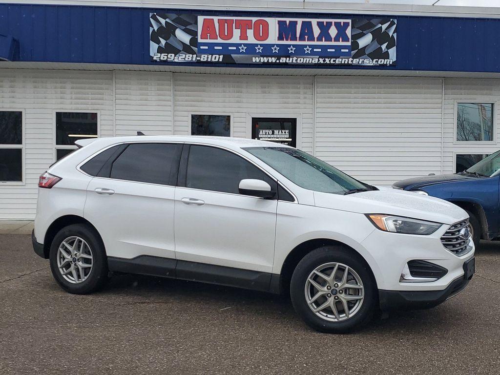 2022 Oxford White /Ebony Ford Edge SEL AWD (2FMPK4J90NB) with an 2.0L L4 DOHC 16V engine, 6A transmission, located at 234 Columbia Ave, Battle Creek, MI, 49015, (269) 222-0088, 42.298264, -85.192543 - Equipment Group 201A: 18&quot; Sparkle Silver-Painted Aluminum Wheels; 3.80 Axle Ratio; ActiveX Seating Material Heated Bucket Seats; 8-Speed Automatic Transmission with SelectShift; Twin-Scroll 2.0L EcoBoost Engine; 245/60R18 AS BSW Tires; TBD GVWR; AM/FM Stereo/MP3 Capable Radio Mini Spare Wheel LED Da - Photo#0