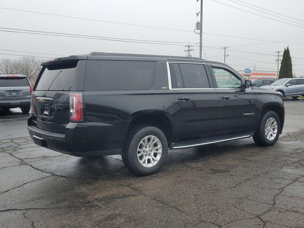 2019 /BLACK GMC Yukon XL SLT 4WD (1GKS2GKC2KR) with an 5.3L V8 OHV 16V engine, 6A transmission, located at 6064 Gull Rd, Kalamazoo, MI, 49048, (269) 222-0088, 42.328388, -85.512924 - Discover the exceptional 2019 GMC Yukon XL 1500 SLT, a versatile and powerful full-size SUV designed to meet all your driving needs. Equipped with a robust V8, 5.3L engine and 4WD capabilities, this vehicle ensures a smooth and commanding drive, whether navigating city streets or exploring off-road - Photo#3