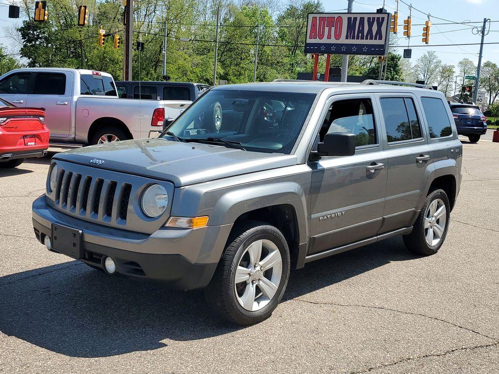 2013 Mineral Gray Metallic Clearcoat /Dark Slate Gray Jeep Patriot Latitude 4WD (1C4NJRFB5DD) with an 2.4L L4 DOHC 16V engine, CVT transmission, located at 234 Columbia Ave, Battle Creek, MI, 49015, (269) 222-0088, 42.298264, -85.192543 - When you encounter slick or muddy roads, you can engage the four wheel drive on this model and drive with confidence. Anti-lock brakes will help you stop in an emergency. The Jeep Patriot has a clean CARFAX vehicle history report. Maintaining a stable interior temperature in this vehicle is easy wit - Photo#3
