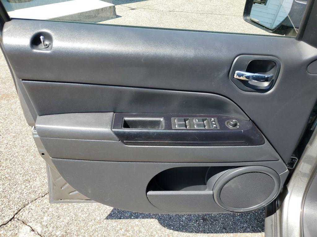 2013 Mineral Gray Metallic Clearcoat /Dark Slate Gray Jeep Patriot Latitude 4WD (1C4NJRFB5DD) with an 2.4L L4 DOHC 16V engine, CVT transmission, located at 234 Columbia Ave, Battle Creek, MI, 49015, (269) 222-0088, 42.298264, -85.192543 - When you encounter slick or muddy roads, you can engage the four wheel drive on this model and drive with confidence. Anti-lock brakes will help you stop in an emergency. The Jeep Patriot has a clean CARFAX vehicle history report. Maintaining a stable interior temperature in this vehicle is easy wit - Photo#5