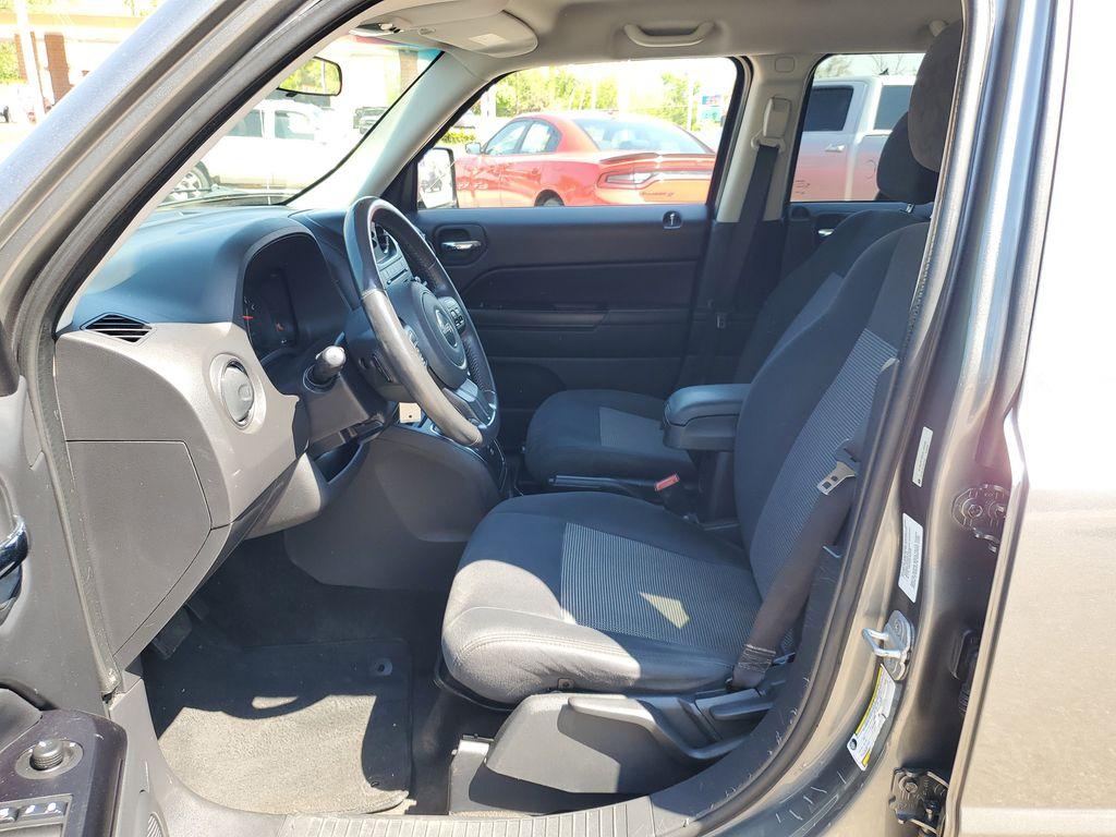 2013 Mineral Gray Metallic Clearcoat /Dark Slate Gray Jeep Patriot Latitude 4WD (1C4NJRFB5DD) with an 2.4L L4 DOHC 16V engine, CVT transmission, located at 234 Columbia Ave, Battle Creek, MI, 49015, (269) 222-0088, 42.298264, -85.192543 - When you encounter slick or muddy roads, you can engage the four wheel drive on this model and drive with confidence. Anti-lock brakes will help you stop in an emergency. The Jeep Patriot has a clean CARFAX vehicle history report. Maintaining a stable interior temperature in this vehicle is easy wit - Photo#7