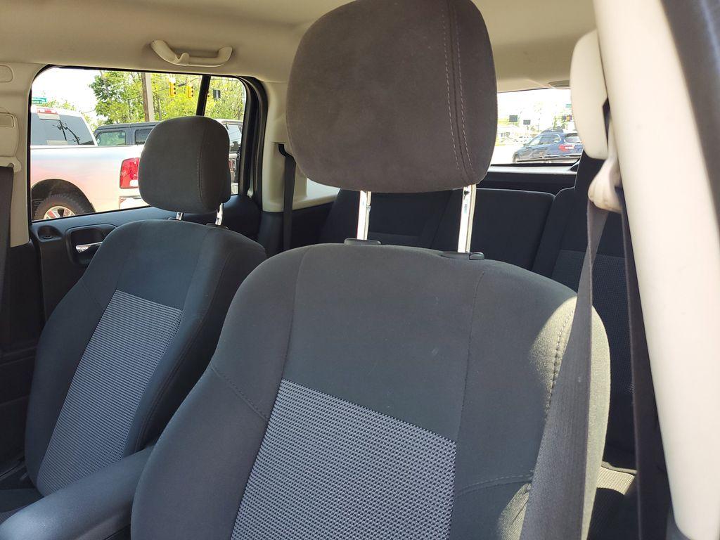 2013 Mineral Gray Metallic Clearcoat /Dark Slate Gray Jeep Patriot Latitude 4WD (1C4NJRFB5DD) with an 2.4L L4 DOHC 16V engine, CVT transmission, located at 234 Columbia Ave, Battle Creek, MI, 49015, (269) 222-0088, 42.298264, -85.192543 - When you encounter slick or muddy roads, you can engage the four wheel drive on this model and drive with confidence. Anti-lock brakes will help you stop in an emergency. The Jeep Patriot has a clean CARFAX vehicle history report. Maintaining a stable interior temperature in this vehicle is easy wit - Photo#9