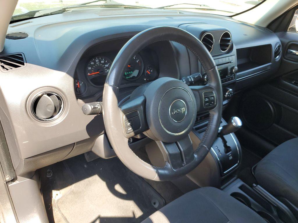 2013 Mineral Gray Metallic Clearcoat /Dark Slate Gray Jeep Patriot Latitude 4WD (1C4NJRFB5DD) with an 2.4L L4 DOHC 16V engine, CVT transmission, located at 234 Columbia Ave, Battle Creek, MI, 49015, (269) 222-0088, 42.298264, -85.192543 - When you encounter slick or muddy roads, you can engage the four wheel drive on this model and drive with confidence. Anti-lock brakes will help you stop in an emergency. The Jeep Patriot has a clean CARFAX vehicle history report. Maintaining a stable interior temperature in this vehicle is easy wit - Photo#10