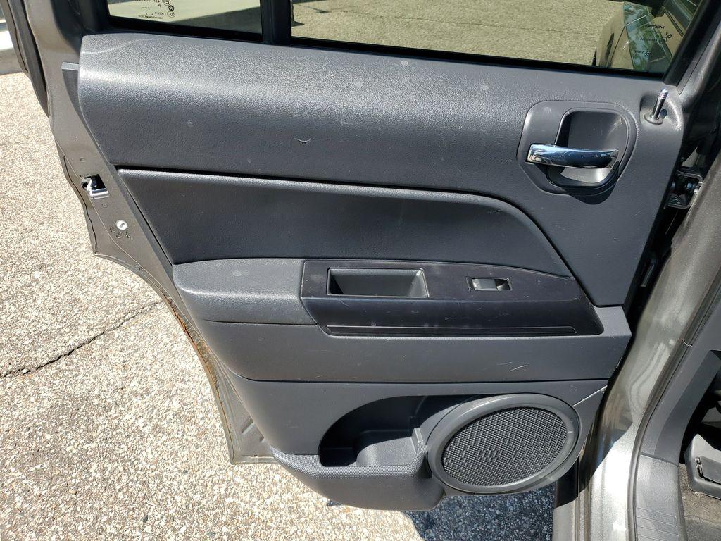 2013 Mineral Gray Metallic Clearcoat /Dark Slate Gray Jeep Patriot Latitude 4WD (1C4NJRFB5DD) with an 2.4L L4 DOHC 16V engine, CVT transmission, located at 234 Columbia Ave, Battle Creek, MI, 49015, (269) 222-0088, 42.298264, -85.192543 - When you encounter slick or muddy roads, you can engage the four wheel drive on this model and drive with confidence. Anti-lock brakes will help you stop in an emergency. The Jeep Patriot has a clean CARFAX vehicle history report. Maintaining a stable interior temperature in this vehicle is easy wit - Photo#19