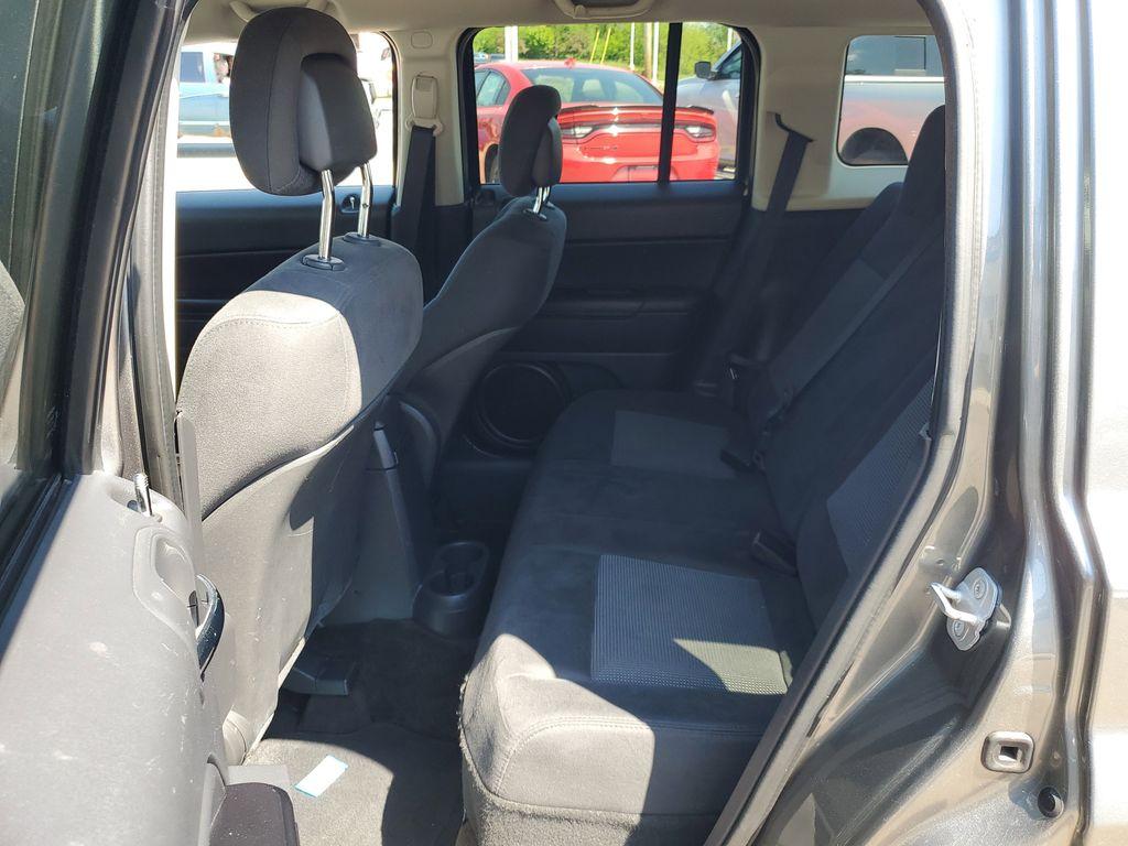2013 Mineral Gray Metallic Clearcoat /Dark Slate Gray Jeep Patriot Latitude 4WD (1C4NJRFB5DD) with an 2.4L L4 DOHC 16V engine, CVT transmission, located at 234 Columbia Ave, Battle Creek, MI, 49015, (269) 222-0088, 42.298264, -85.192543 - When you encounter slick or muddy roads, you can engage the four wheel drive on this model and drive with confidence. Anti-lock brakes will help you stop in an emergency. The Jeep Patriot has a clean CARFAX vehicle history report. Maintaining a stable interior temperature in this vehicle is easy wit - Photo#20