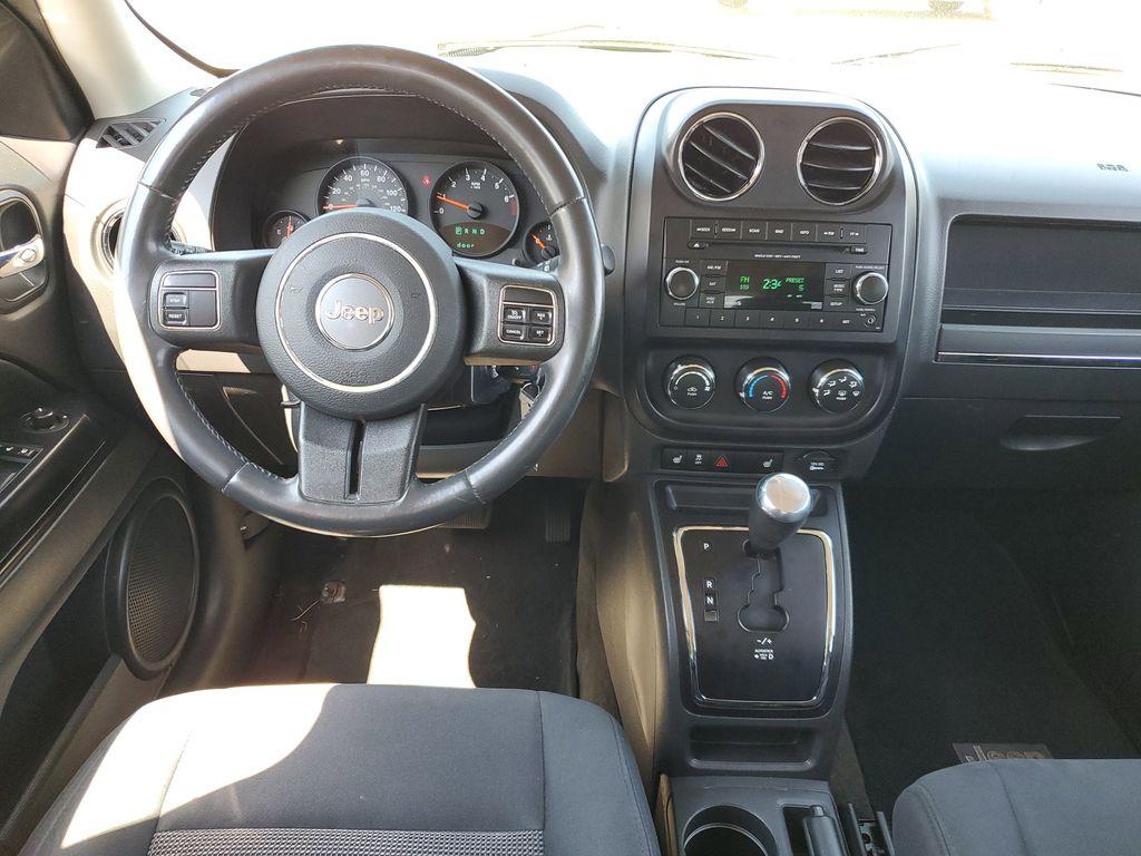 2013 Mineral Gray Metallic Clearcoat /Dark Slate Gray Jeep Patriot Latitude 4WD (1C4NJRFB5DD) with an 2.4L L4 DOHC 16V engine, CVT transmission, located at 234 Columbia Ave, Battle Creek, MI, 49015, (269) 222-0088, 42.298264, -85.192543 - When you encounter slick or muddy roads, you can engage the four wheel drive on this model and drive with confidence. Anti-lock brakes will help you stop in an emergency. The Jeep Patriot has a clean CARFAX vehicle history report. Maintaining a stable interior temperature in this vehicle is easy wit - Photo#21