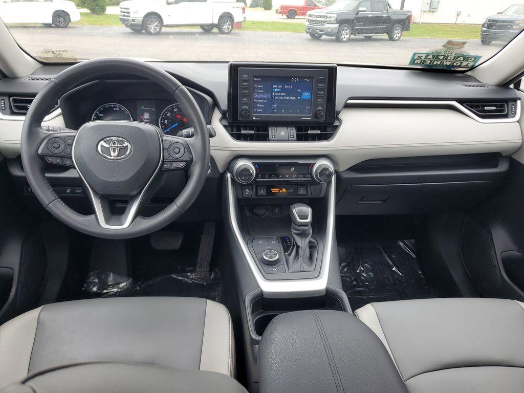 2021 Blizzard Pearl /Ash Toyota RAV4 Hybrid XLE AWD (2T3B6RFV5MW) with an 2.5L L4 DOHC 16V HYBRID engine, CVT transmission, located at 6064 Gull Rd, Kalamazoo, MI, 49048, (269) 222-0088, 42.328388, -85.512924 - Discover the perfect blend of reliability and style with this 2021 Toyota RAV4 XLE Premium, now available with AWD for enhanced performance. This versatile SUV is powered by a robust 4-cylinder, 2.5L engine, ensuring a smooth and efficient driving experience.<br><br>This Toyota RAV4 comes with a CAR - Photo#8