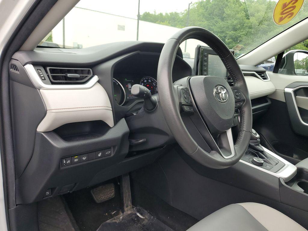2021 Blizzard Pearl /Ash Toyota RAV4 Hybrid XLE AWD (2T3B6RFV5MW) with an 2.5L L4 DOHC 16V HYBRID engine, CVT transmission, located at 6064 Gull Rd, Kalamazoo, MI, 49048, (269) 222-0088, 42.328388, -85.512924 - Discover the perfect blend of reliability and style with this 2021 Toyota RAV4 XLE Premium, now available with AWD for enhanced performance. This versatile SUV is powered by a robust 4-cylinder, 2.5L engine, ensuring a smooth and efficient driving experience.<br><br>This Toyota RAV4 comes with a CAR - Photo#14