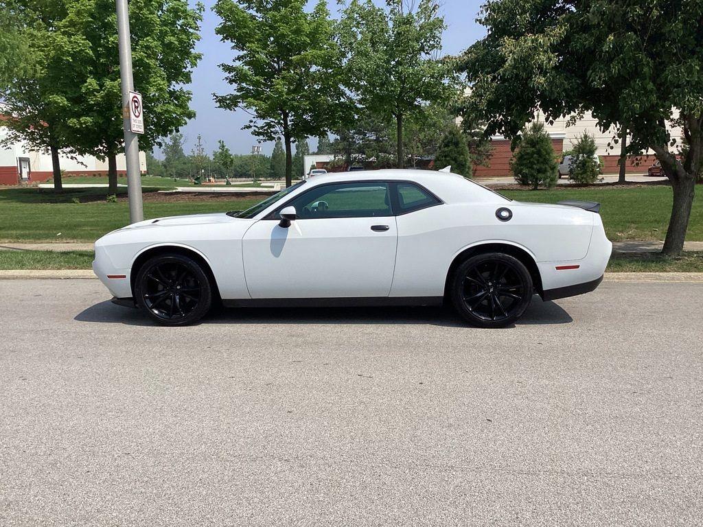 2017 /Black Dodge Challenger SXT (2C3CDZAG6HH) with an 3.6L V6 DOHC 24V engine, 8A transmission, located at 6064 Gull Rd, Kalamazoo, MI, 49048, (269) 222-0088, 42.328388, -85.512924 - <b>Summary</b><br>Power Moonroof<br><br><b>Vehicle Details</b><br>Experience the thrill of driving with this stunning 2017 Dodge Challenger SXT, a true embodiment of power and style. This remarkable vehicle features a robust V6, 3.6L engine paired with rear-wheel drive, offering an exhilarating yet - Photo#3