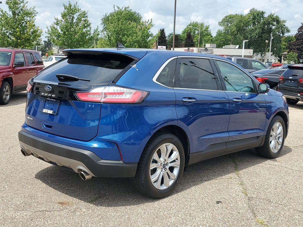 2022 Atlas Blue Metallic /Ebony Ford Edge Titanium AWD (2FMPK4K95NB) with an 2.0L L4 DOHC 16V engine, 6A transmission, located at 234 Columbia Ave, Battle Creek, MI, 49015, (269) 222-0088, 42.298264, -85.192543 - <b>Vehicle Details</b><br>Discover the exceptional blend of performance, technology, and comfort with this 2022 Ford Edge Titanium AWD. Equipped with a dynamic 4-cylinder, 2.0L engine, this SUV offers a smooth and responsive drive, making it perfect for both city commutes and weekend getaways. Stay - Photo#1