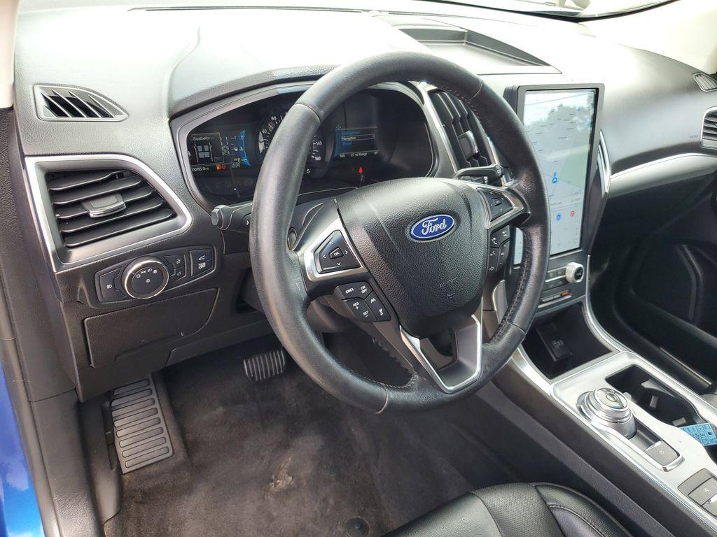 2022 Atlas Blue Metallic /Ebony Ford Edge Titanium AWD (2FMPK4K95NB) with an 2.0L L4 DOHC 16V engine, 6A transmission, located at 234 Columbia Ave, Battle Creek, MI, 49015, (269) 222-0088, 42.298264, -85.192543 - <b>Vehicle Details</b><br>Discover the exceptional blend of performance, technology, and comfort with this 2022 Ford Edge Titanium AWD. Equipped with a dynamic 4-cylinder, 2.0L engine, this SUV offers a smooth and responsive drive, making it perfect for both city commutes and weekend getaways. Stay - Photo#11