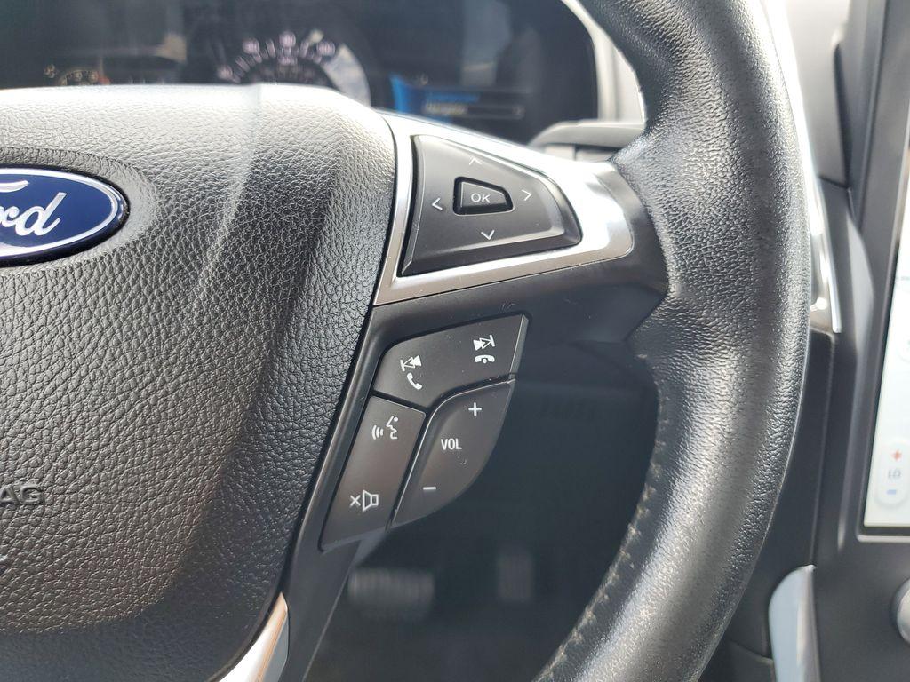 2022 Atlas Blue Metallic /Ebony Ford Edge Titanium AWD (2FMPK4K95NB) with an 2.0L L4 DOHC 16V engine, 6A transmission, located at 234 Columbia Ave, Battle Creek, MI, 49015, (269) 222-0088, 42.298264, -85.192543 - <b>Vehicle Details</b><br>Discover the exceptional blend of performance, technology, and comfort with this 2022 Ford Edge Titanium AWD. Equipped with a dynamic 4-cylinder, 2.0L engine, this SUV offers a smooth and responsive drive, making it perfect for both city commutes and weekend getaways. Stay - Photo#17