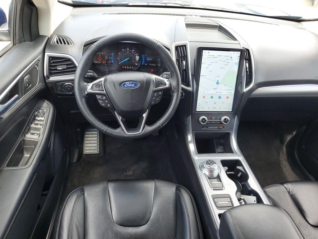 2022 Atlas Blue Metallic /Ebony Ford Edge Titanium AWD (2FMPK4K95NB) with an 2.0L L4 DOHC 16V engine, 6A transmission, located at 234 Columbia Ave, Battle Creek, MI, 49015, (269) 222-0088, 42.298264, -85.192543 - <b>Vehicle Details</b><br>Discover the exceptional blend of performance, technology, and comfort with this 2022 Ford Edge Titanium AWD. Equipped with a dynamic 4-cylinder, 2.0L engine, this SUV offers a smooth and responsive drive, making it perfect for both city commutes and weekend getaways. Stay - Photo#28