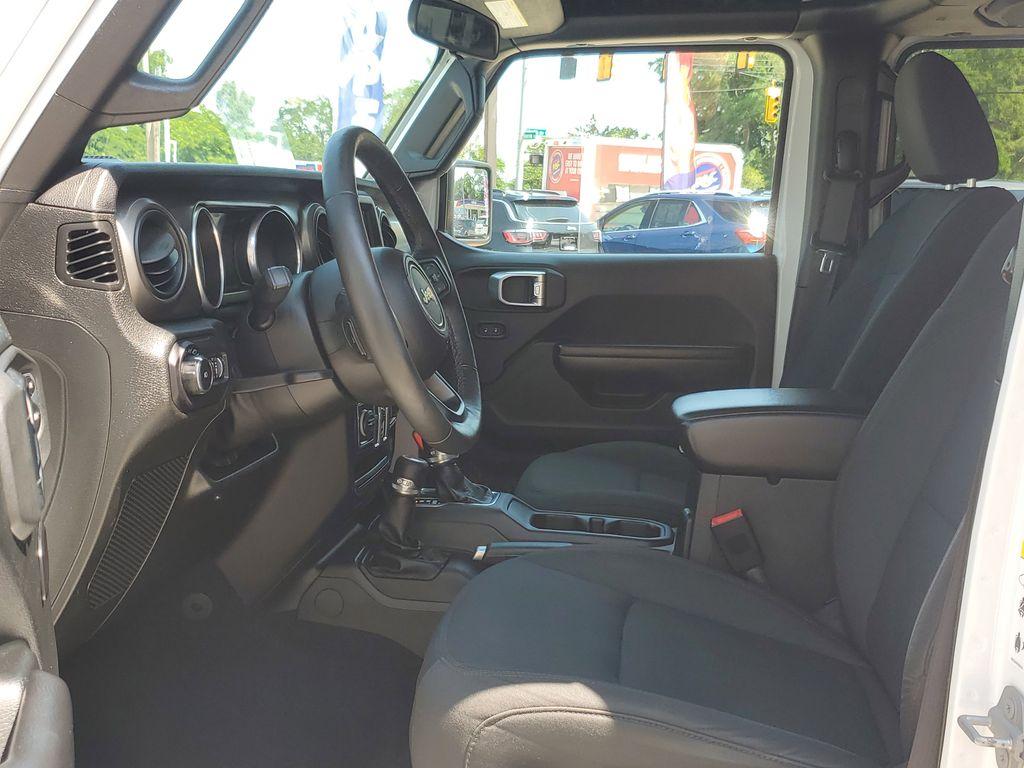 2018 Bright White Clearcoat /Black Jeep Wrangler JK Unlimited Sport (1C4HJXDG9JW) with an 3.6L V6 DOHC 24V FFV engine, 6A transmission, located at 234 Columbia Ave, Battle Creek, MI, 49015, (269) 222-0088, 42.298264, -85.192543 - <b>Vehicle Details</b><br>Unleash your adventurous spirit with this stunning 2018 Jeep Wrangler Sport S! Engineered for excitement and built to conquer any terrain, this dynamic 4WD powerhouse is equipped with a robust V6, 3.6L engine that delivers exceptional performance and reliability. Whether yo - Photo#7