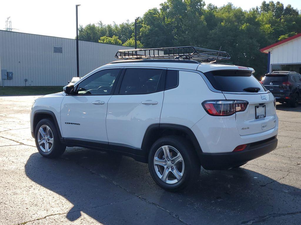 2023 Bright White Clearcoat /BLACK Jeep Compass Latitude (3C4NJDBNXPT) with an 2.0L L4 DOHC 16V TURBO engine, 8-speed automatic transmission, located at 6064 Gull Rd, Kalamazoo, MI, 49048, (269) 222-0088, 42.328388, -85.512924 - Experience the perfect blend of style, performance, and technology with this pre-owned 2023 Jeep Compass Latitude. Equipped with a robust 4-cylinder, 2.0L engine and advanced 4WD capabilities, this vehicle is ready to tackle both city streets and off-road adventures with confidence. The Jeep Compass - Photo#2