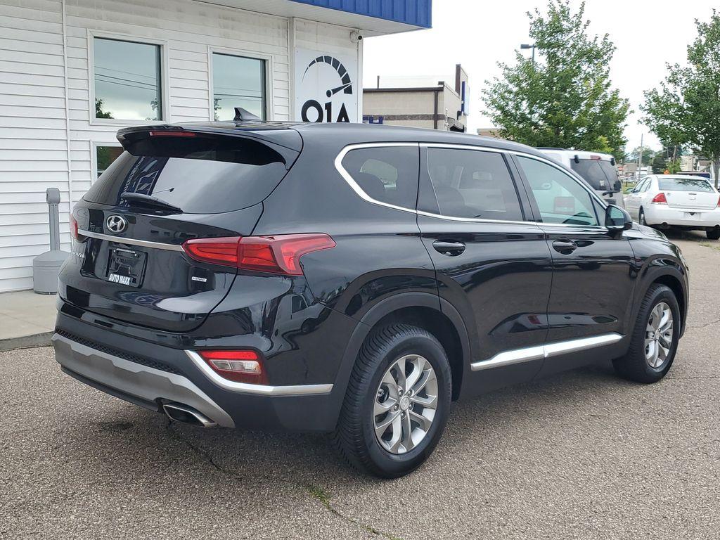 2020 Twilight Black /Espresso/Gray Hyundai Santa Fe SEL 2.4 AWD (5NMS3CAD3LH) with an 2.4L L4 DOHC 16V engine, 8A transmission, located at 234 Columbia Ave, Battle Creek, MI, 49015, (269) 222-0088, 42.298264, -85.192543 - <b>Vehicle Details</b><br>Looking for a reliable SUV that combines comfort, technology, and performance? Discover the 2020 Hyundai Santa Fe SEL with 4WD, now available for sale. This versatile vehicle, with a 4-cylinder, 2.4L engine, delivers an impressive balance of power and efficiency, making it - Photo#1