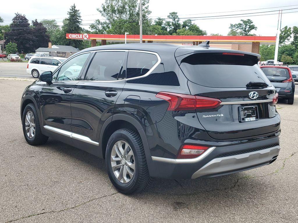 2020 Twilight Black /Espresso/Gray Hyundai Santa Fe SEL 2.4 AWD (5NMS3CAD3LH) with an 2.4L L4 DOHC 16V engine, 8A transmission, located at 234 Columbia Ave, Battle Creek, MI, 49015, (269) 222-0088, 42.298264, -85.192543 - <b>Vehicle Details</b><br>Looking for a reliable SUV that combines comfort, technology, and performance? Discover the 2020 Hyundai Santa Fe SEL with 4WD, now available for sale. This versatile vehicle, with a 4-cylinder, 2.4L engine, delivers an impressive balance of power and efficiency, making it - Photo#2